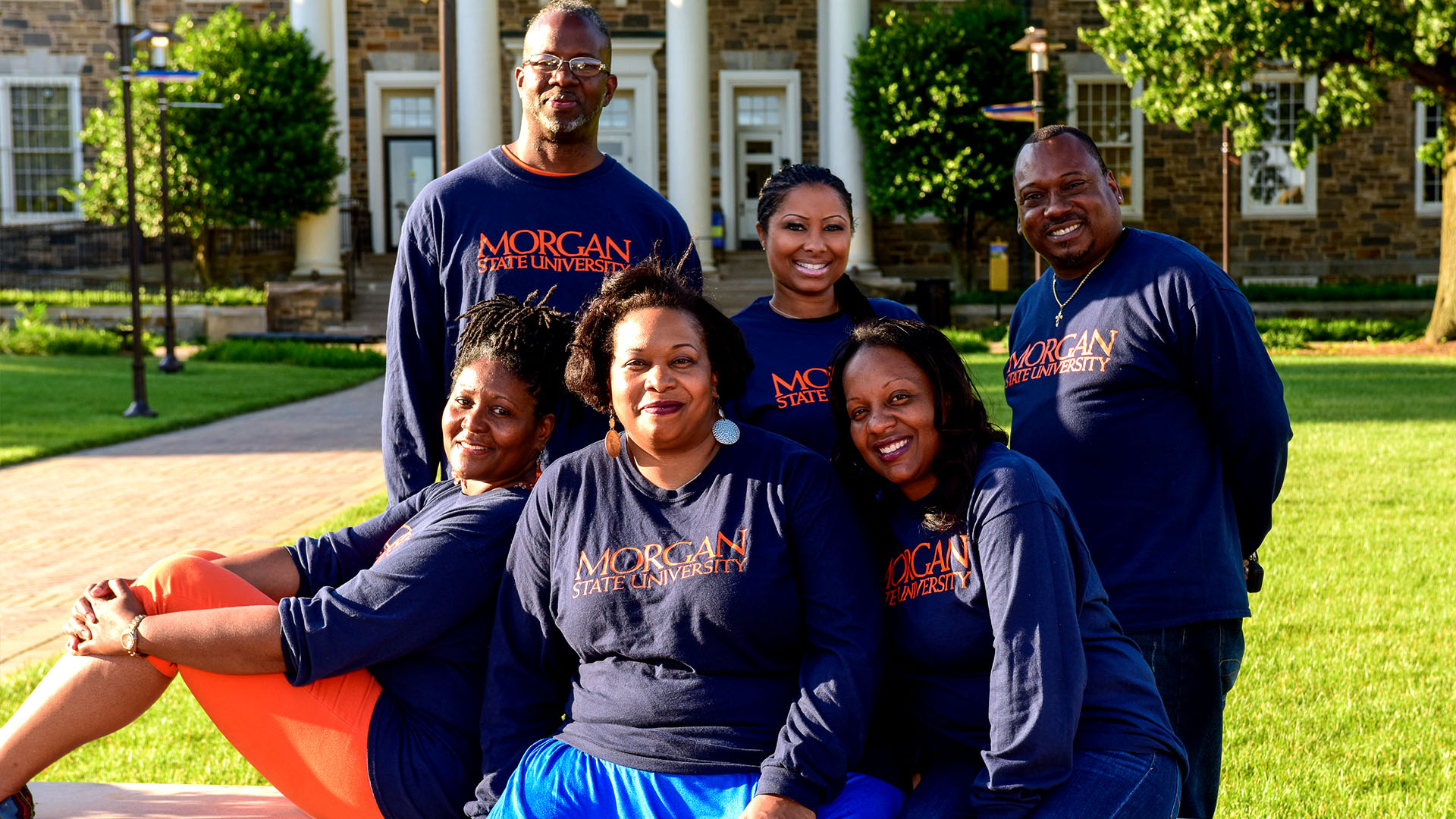 Non-Traditional Students smiling in front of Holmes Hall