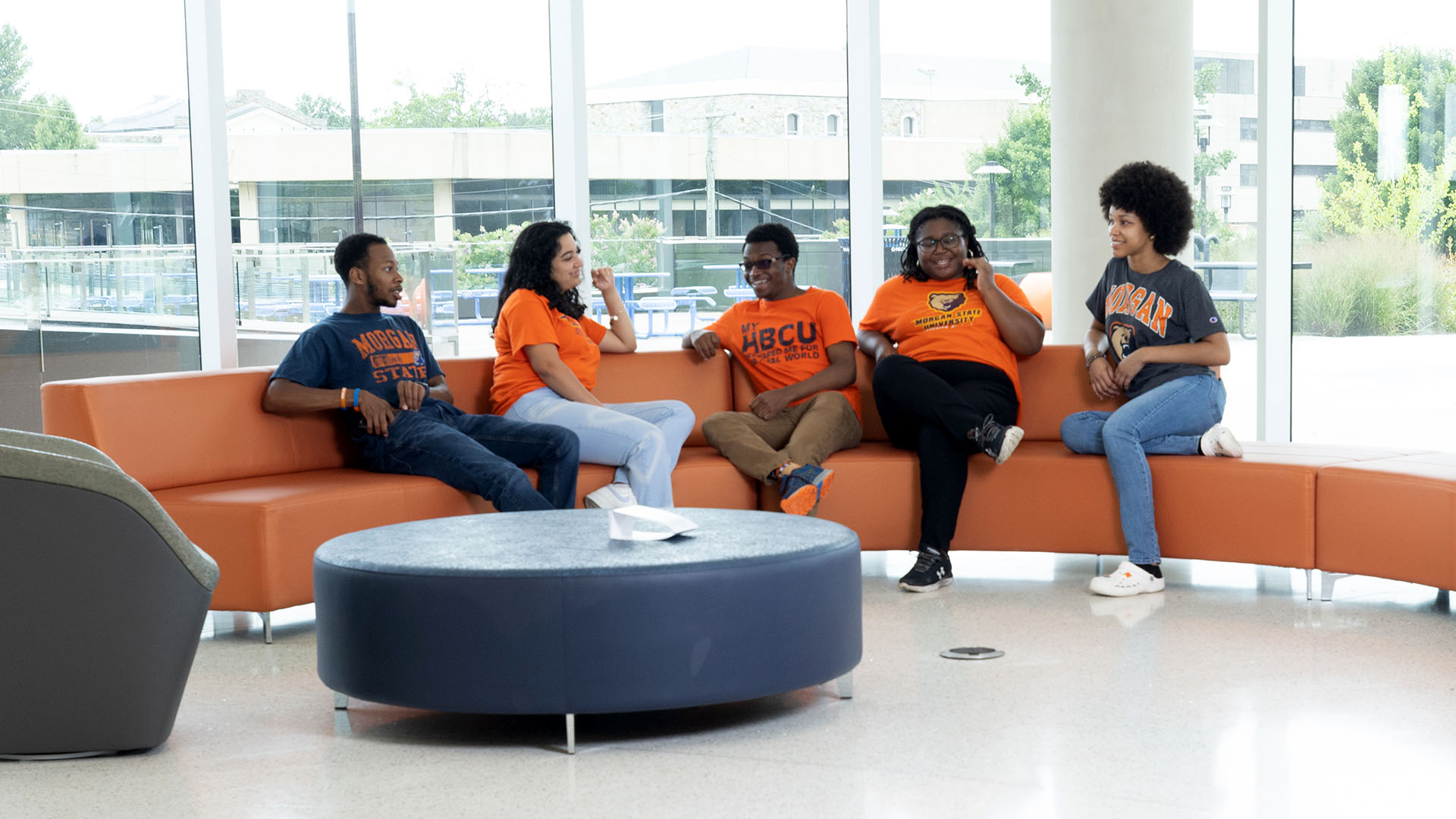 students sitting on a couch