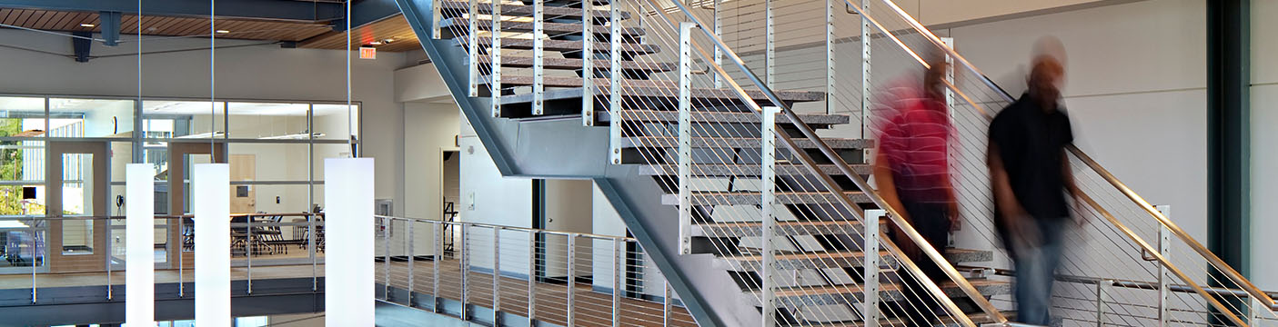 two individuals walking down the stairs