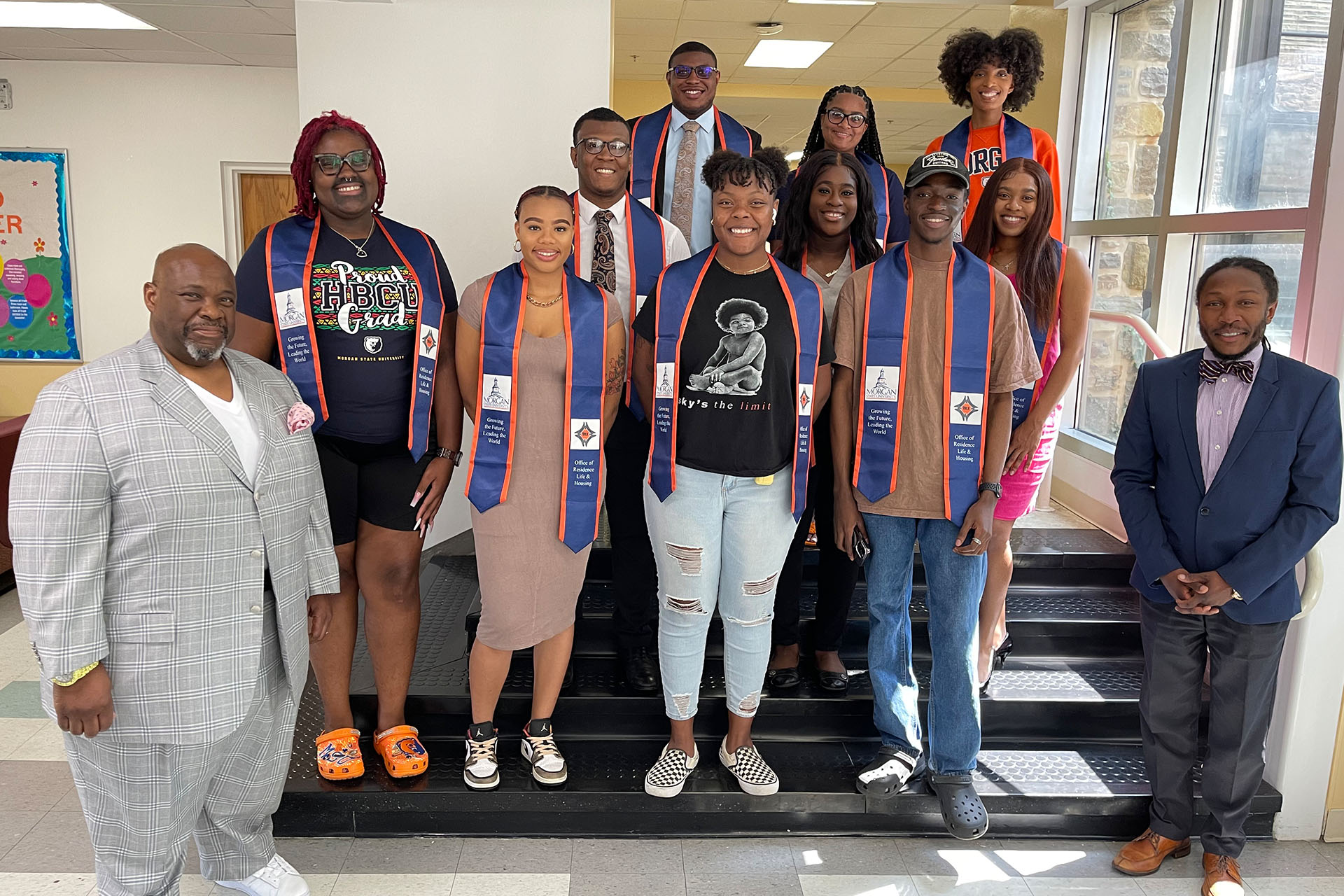 Residence Life staff smiling with graduating students