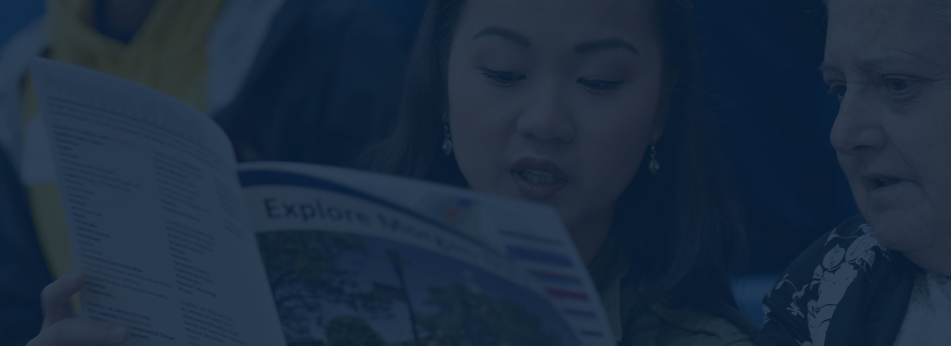 student reading explore morgan pamphlet