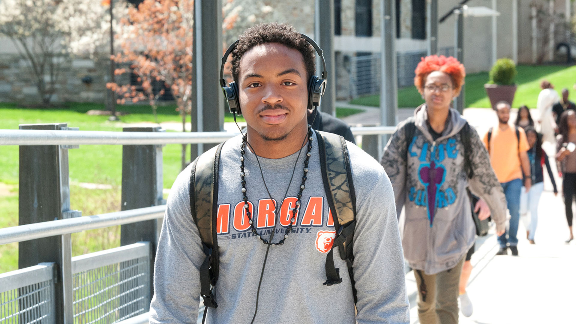 students walking on bridge