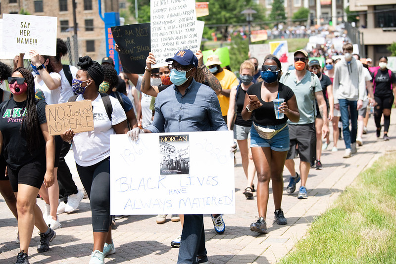 Wilson walking with protestors