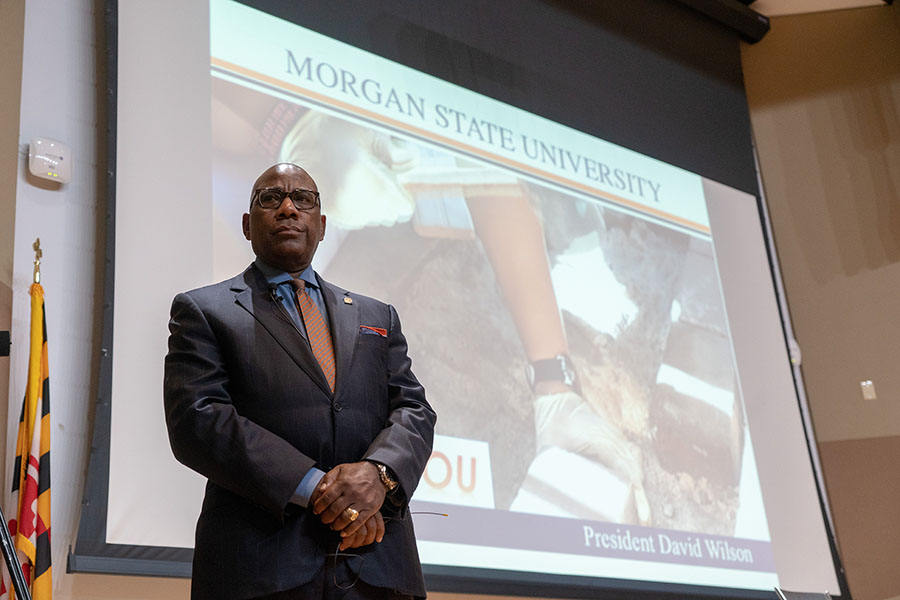 |President Willson sitting on an orange couch