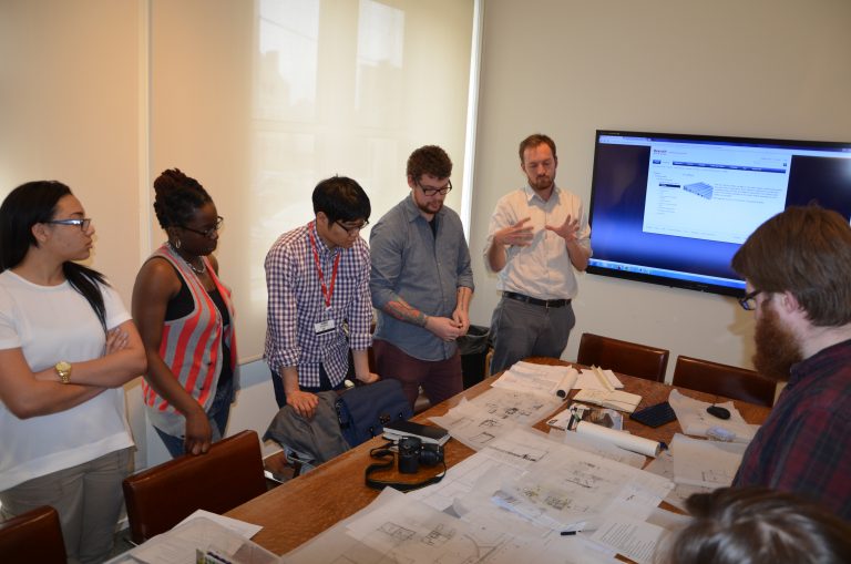 student group with staff in conference room