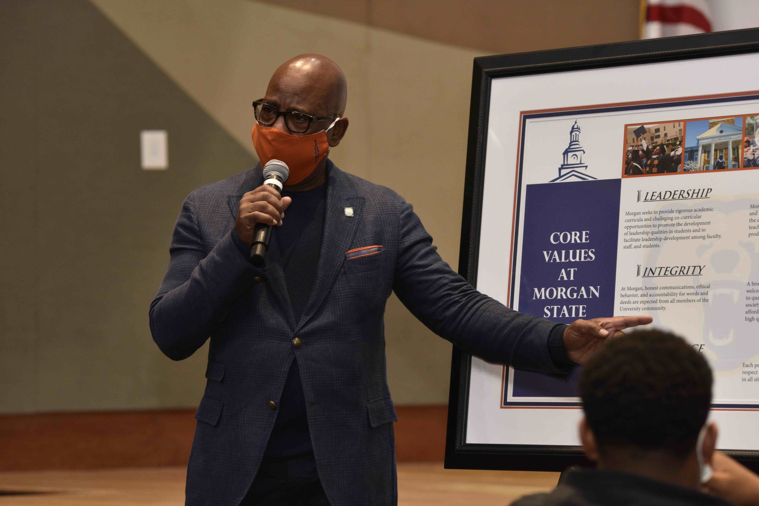 President Wilson masked up presenting at town hall