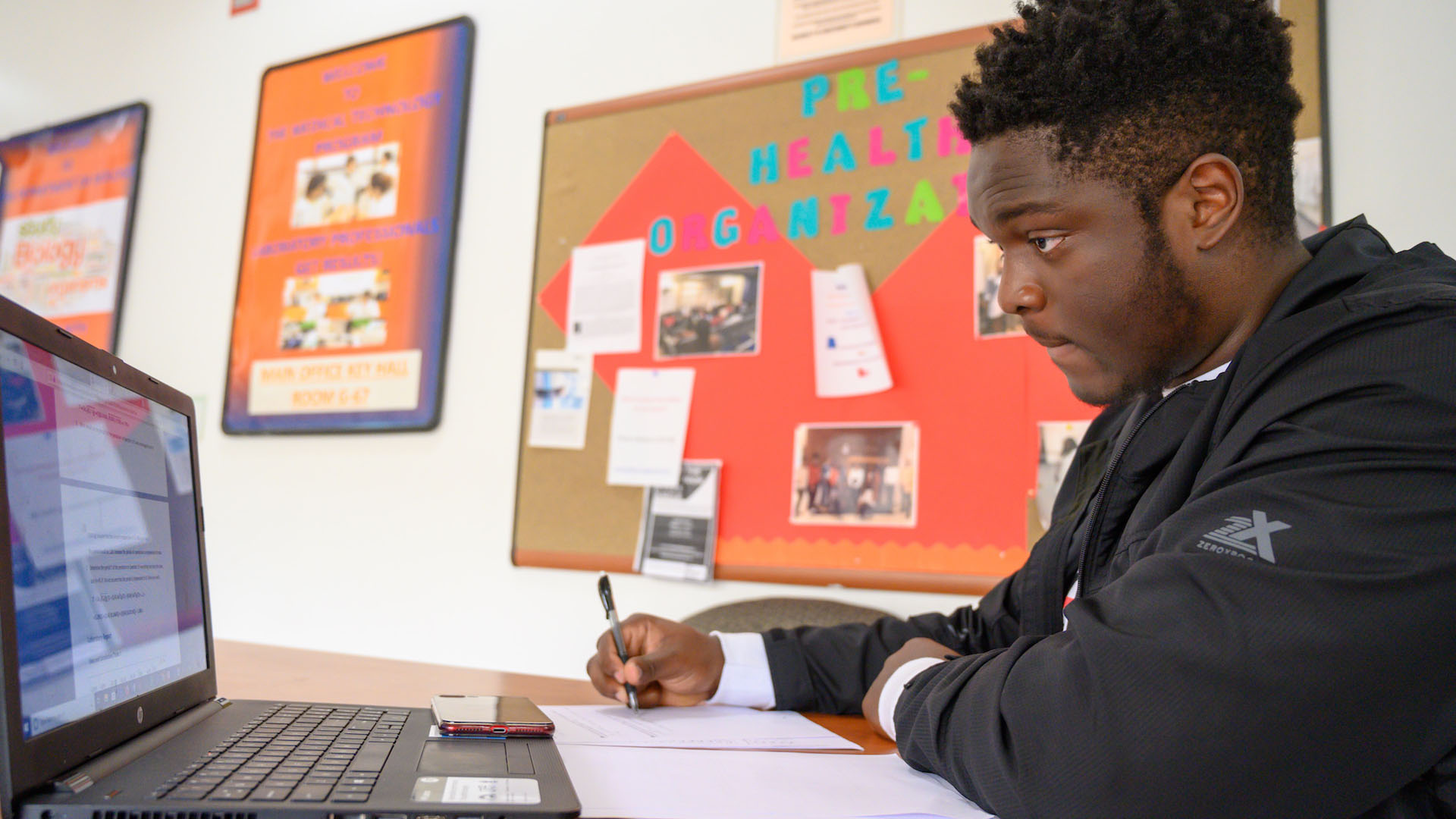 male student on a laptop computer