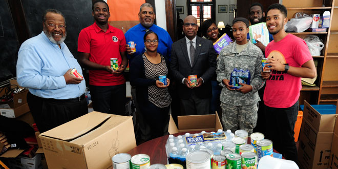 photo of Dean of University Chapel, VP of Student Affairs, President Wilson, and students