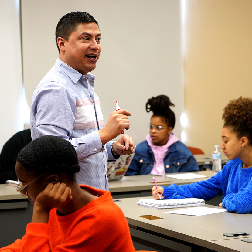 teacher with students in a classroom